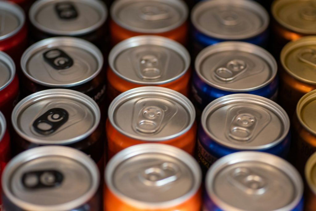Close up shot of group of soft drink cans