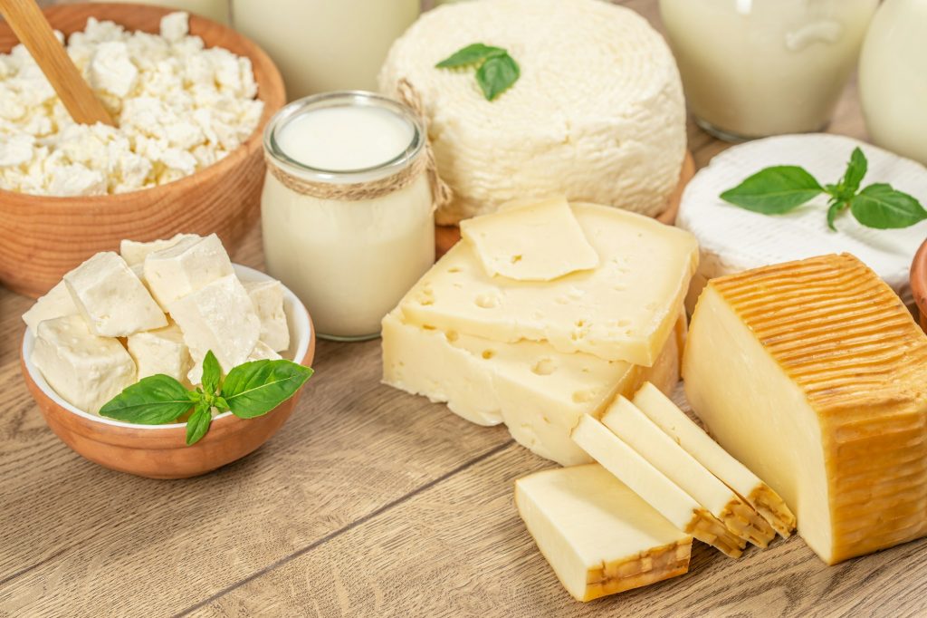 Natural dairy products. cottage cheese, milk on a wooden background. top view