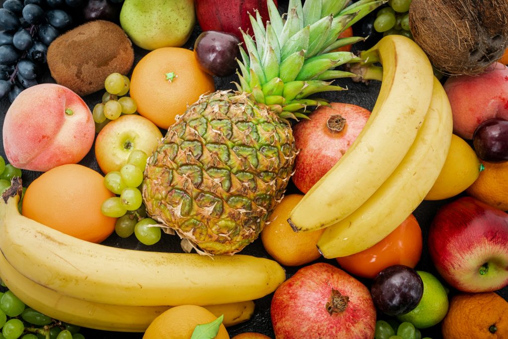 Various assorted juicy fruits. Fresh fruits colorful background.